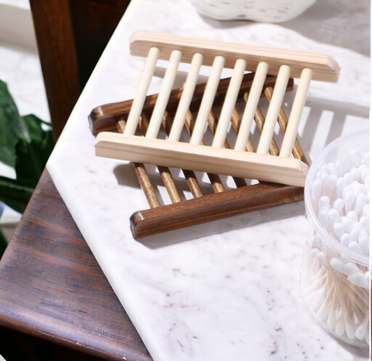 A stack of Bamboo Wooden Self Draining Soap Dish from 570 Soap Co.