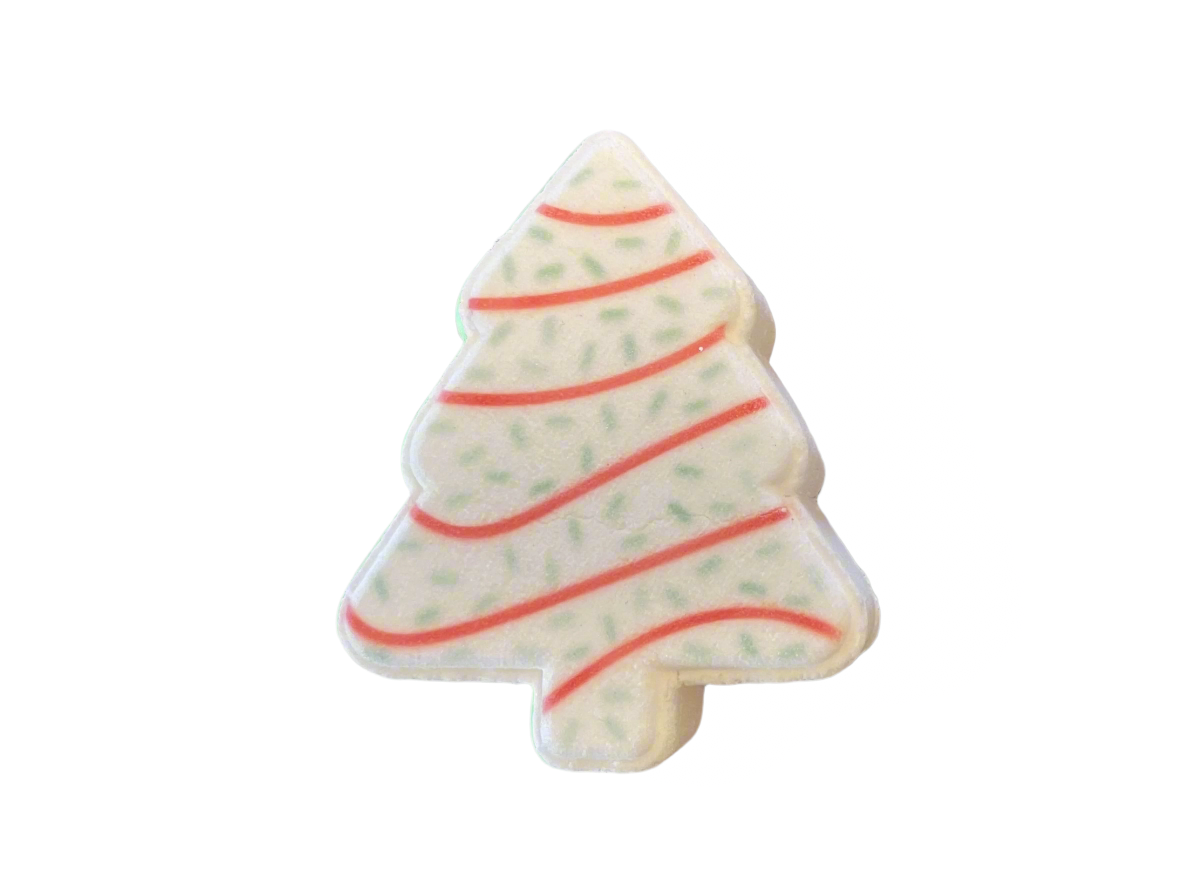A Christmas tree-shaped bath bomb adorned with red swirl lines, and green dots.