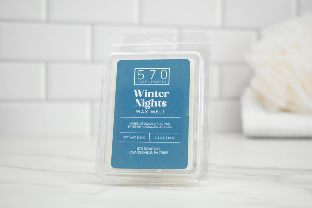 570 Winter Nights wax melt packaging on a white tiled background