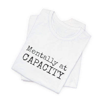 White tank top with 'Mentally at CAPACITY' text on a white background