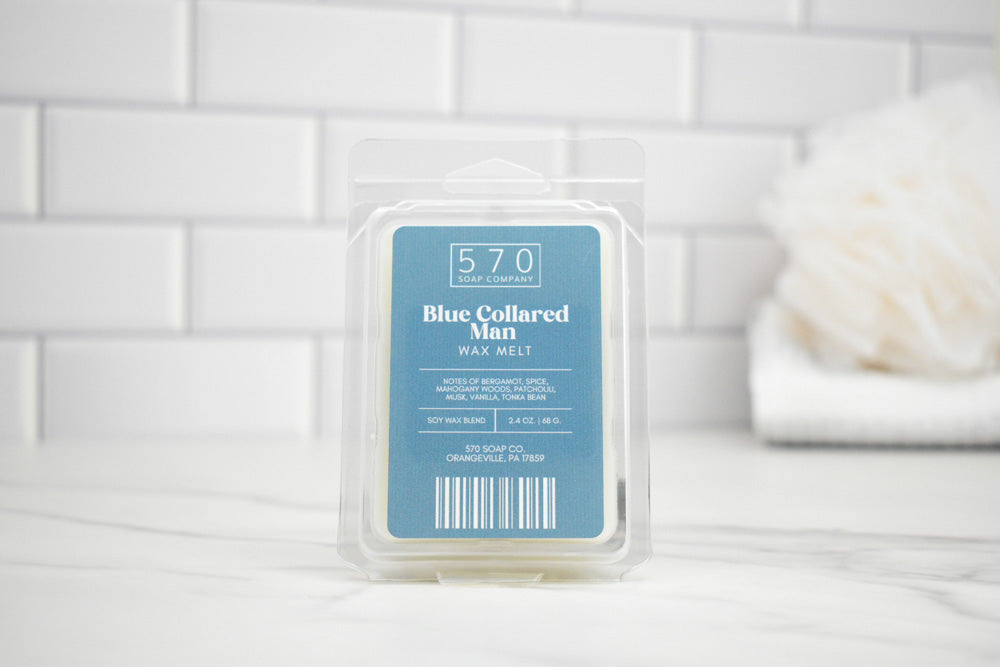 Pack of wax melts with a blue label on a white tiled surface