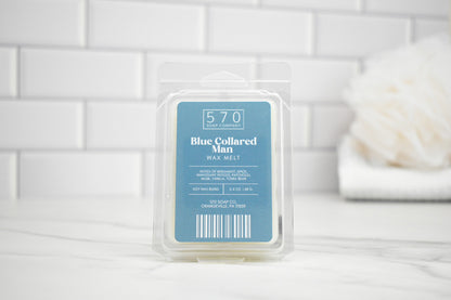 Pack of wax melts with a blue label on a white tiled surface