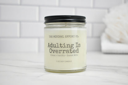 Candle jar with 'The Minimal Effort Co.' label on a white surface