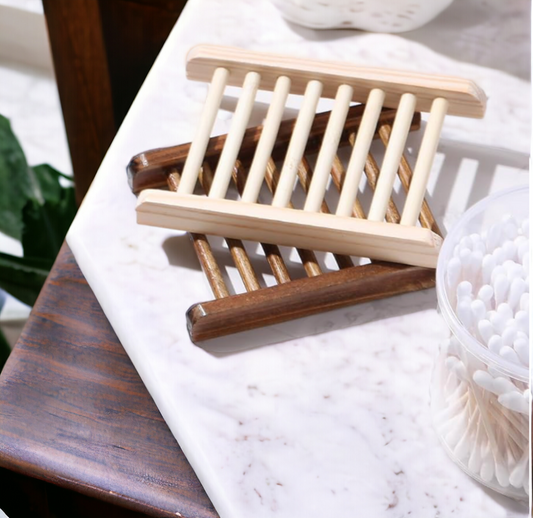 A stack of Bamboo Wooden Self Draining Soap Dish from 570 Soap Co. 