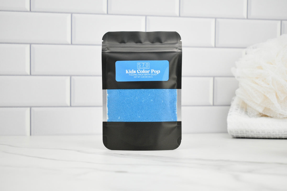 Black packaging with blue content on a white tiled background