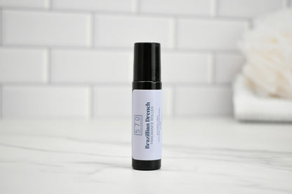 Skincare product bottle with white label on a white surface with a tiled wall background