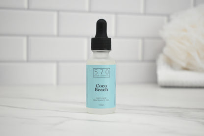 Bottle of 570 Coco Beach product on a white surface with a tiled wall background