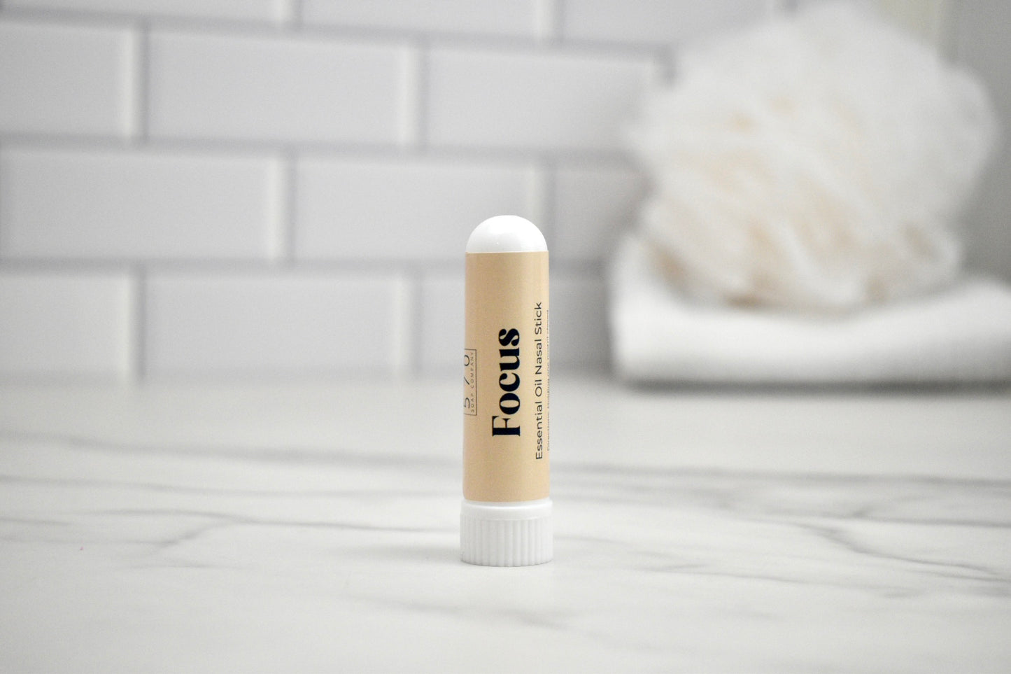Nasal stick with 'Focus' text on a white surface