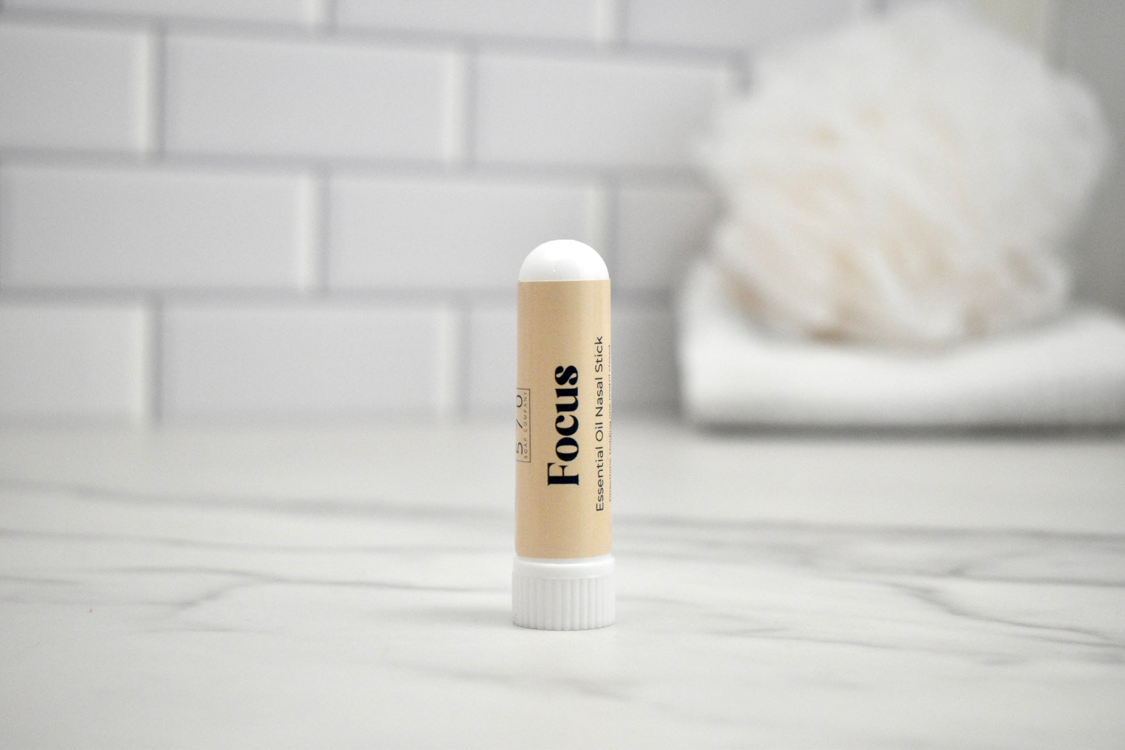 Nasal stick with 'Focus' text on a white surface