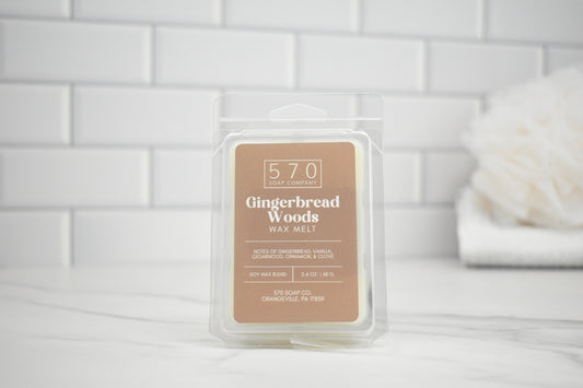 570 Soap and Candle Gingerbread Woods wax melt packaging on a white tiled background