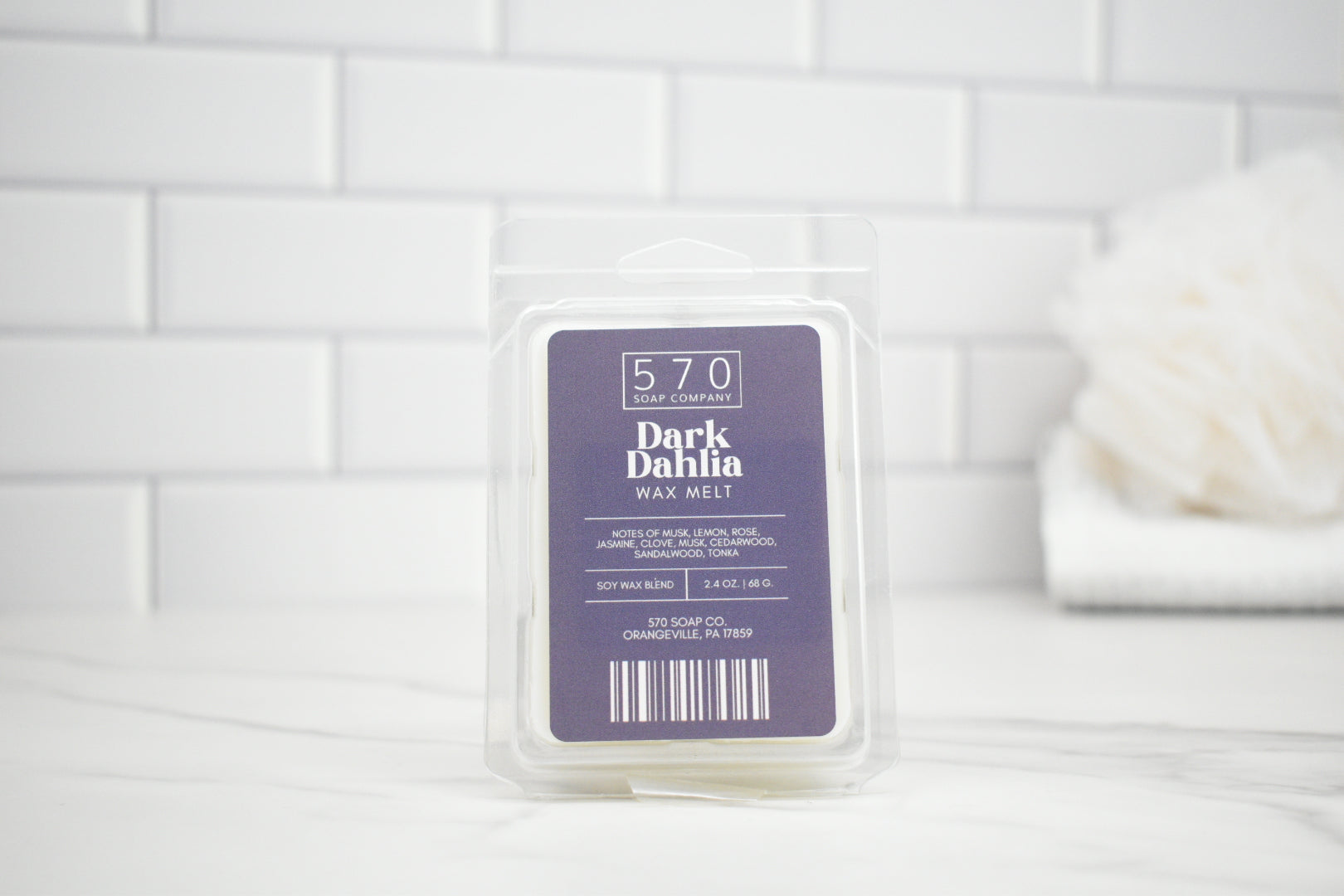 570 Soap Co. Dark Dahlia wax melt packaging on a white tiled background