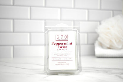 570 Peppermint Twist wax melt packaging on a white surface with a tiled wall background
