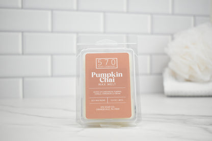 Pumpkin Chai wax melt packaging on a white tiled background