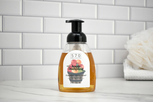 Foamed hand soap bottle with label on a bathroom counter