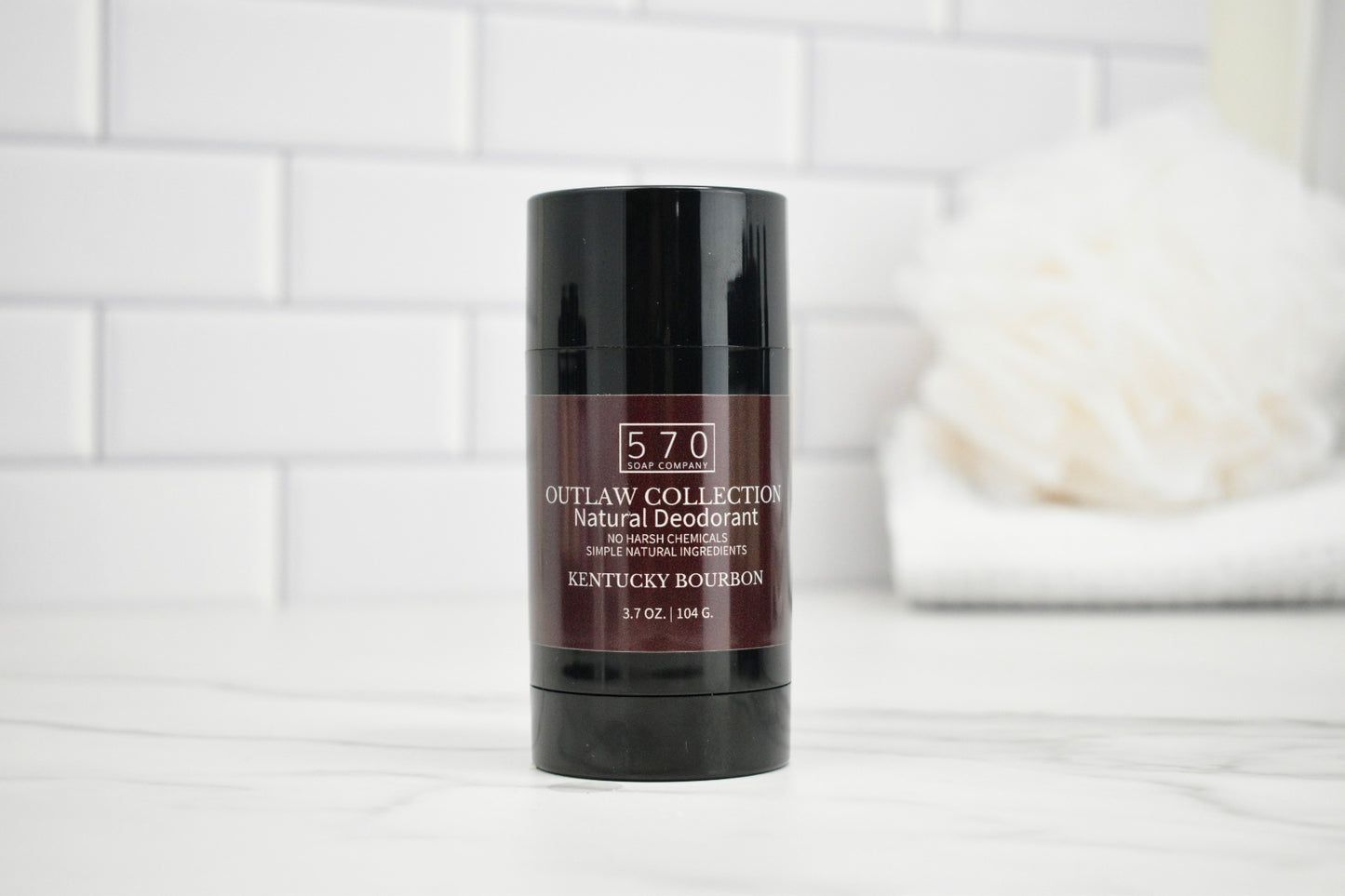 Deodorant stick with '570' branding on a white surface with a blurred background