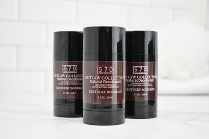 Three deodorant sticks from the 570 Outlaw Collection on a white background