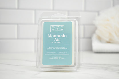 Mountain Air Wax melt in packaging with blurred background