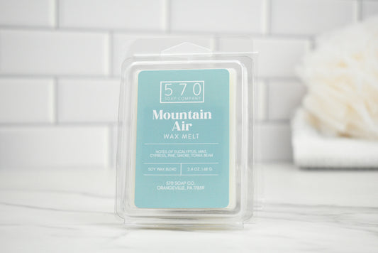 Mountain Air Wax melt in packaging with blurred background