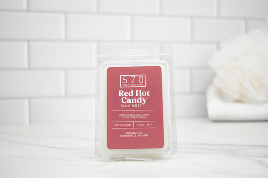 Red Hot Candy wax melt packaging on a white tiled background