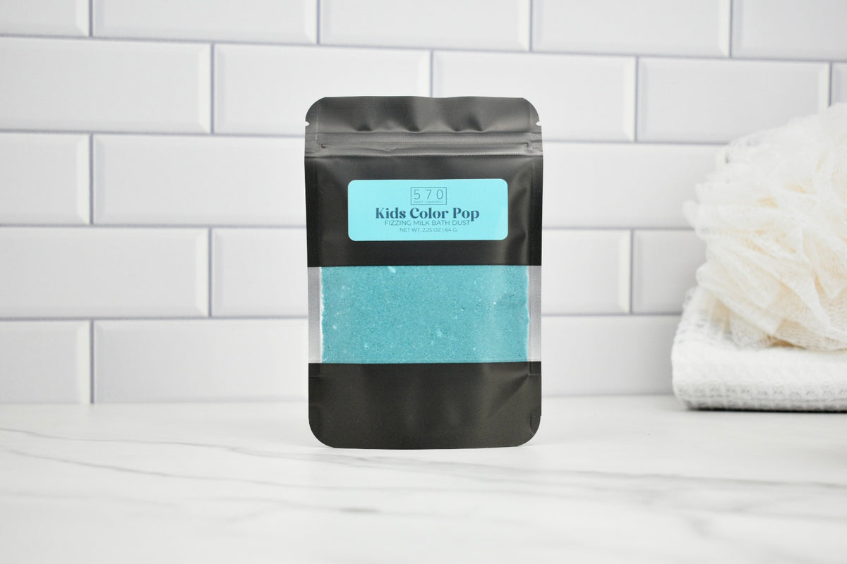 Black packaging with a blue label on a white tiled wall background