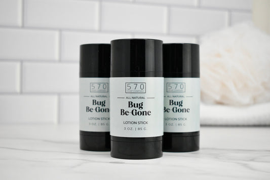 Three 'Bug Be Gone' lotion sticks with black and white labels on a white surface.