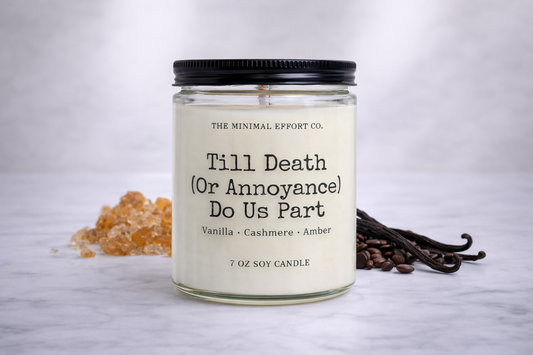 Candle with text 'Till Death (Or Annoyance) Do Us Part' on a neutral background