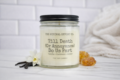 Candle with label 'Till Death (Or Annoyance) Do Us Part' from The Minimal Effort Co. on a white background.