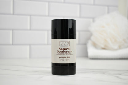 570 Natural Deodorant stick on a white surface with a blurred background