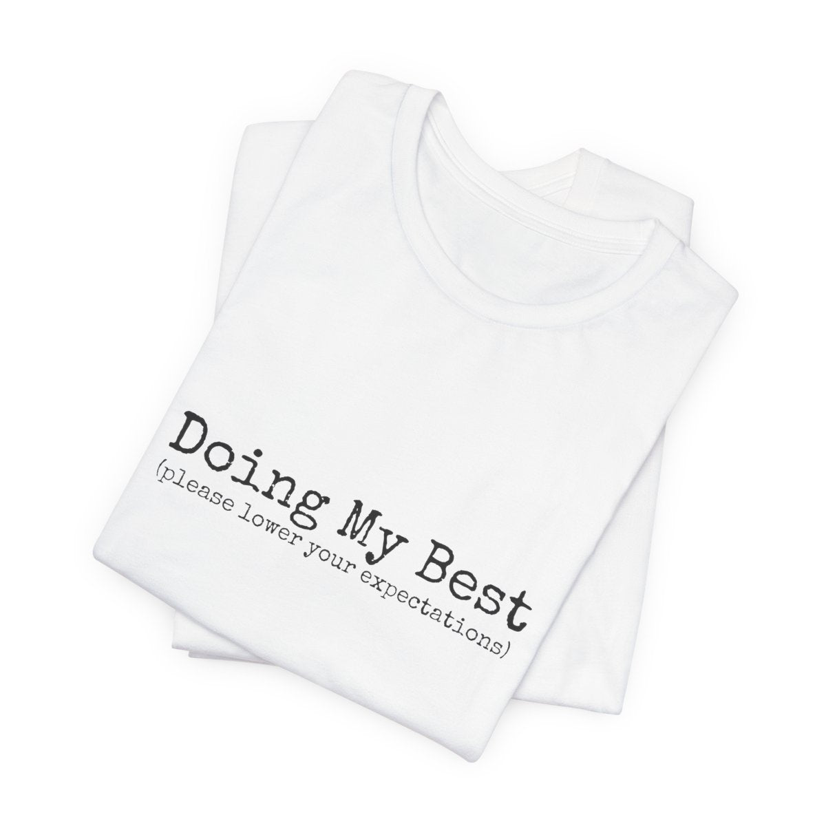 White tank top with text 'Doing My Best (please lower your expectations)' on a white background